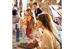 Image Women drinking wine at a restaurant.